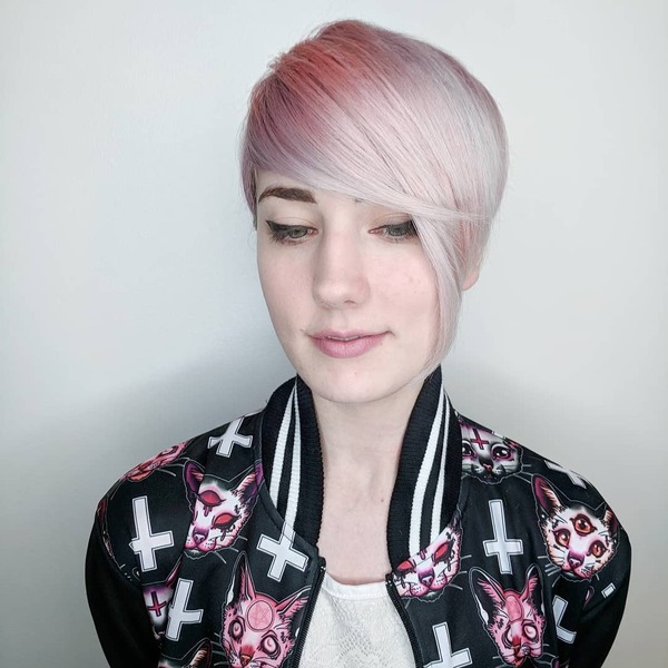 Asymmetrical Pixie Cut with Light Pink Over Top- a woman wearing a black jacket