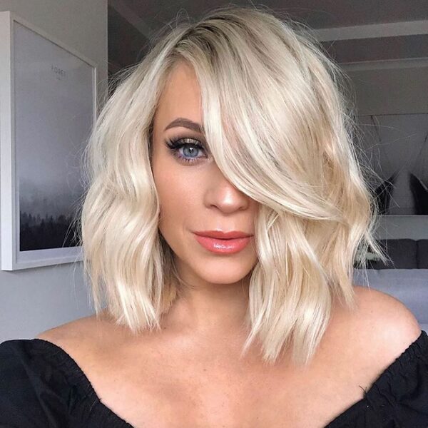 Baby Blonde Hair Color Ideas for Short Hair- a woman wearing a black blouse