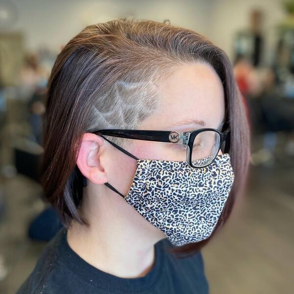 Bob Cut Hair with Side Undercut Design- a woman wearing a face mask