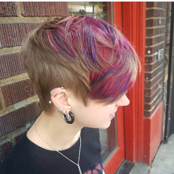 Brown Pixie Cut with Multicolored Hair Highlights- a woman wearing a black t-shirt