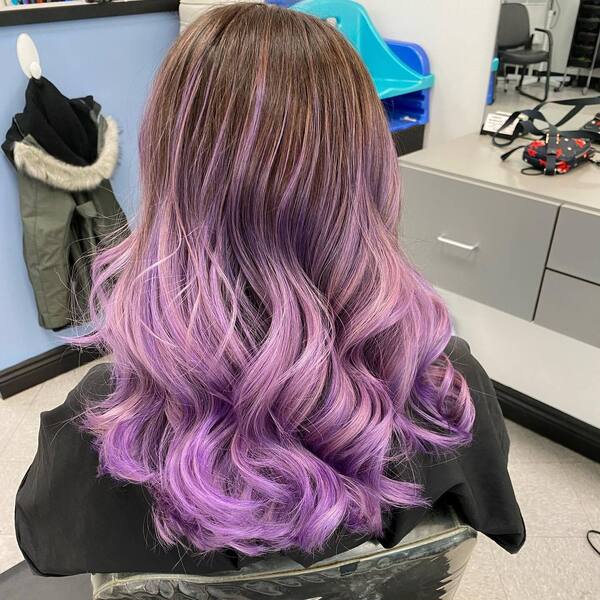 Brown to Pastel Purple Ombre- a woman wearing a black barber's cape