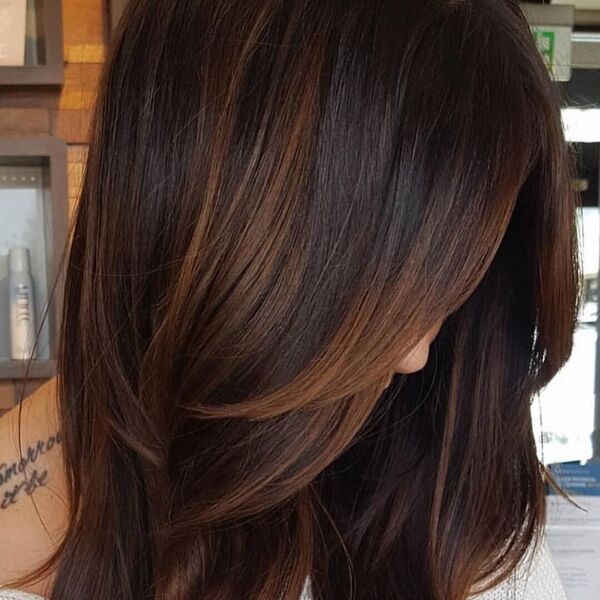 Cocoa Hair Color Ideas- a woman with a tattoo