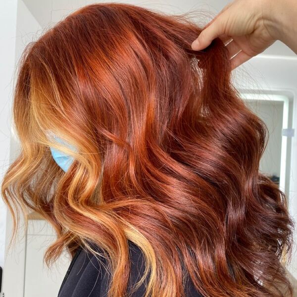 Copper Ombre Hairstyles- a woman wearing a face mask
