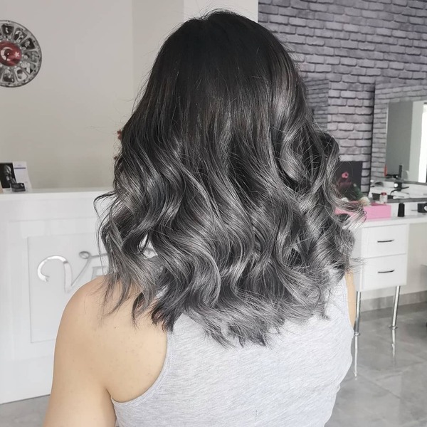 Gray Ombre Hair Color Ideas for Dark Hair- a woman wearing a gray tank top