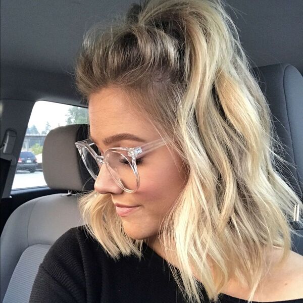 Half-Up Half-Down Blonde Hairstyles- a woman wearing an eye glass