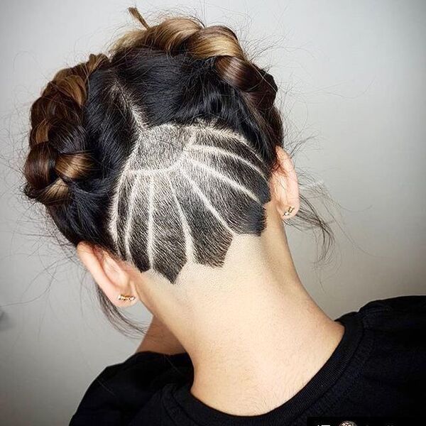 Intricate Nape Undercut with Braided and Messy Updo- a woman wearing a black t-shirt