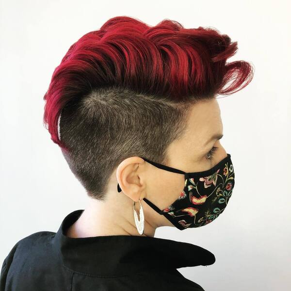 Pixie Undercut with Intense Red Highlight- a woman wearing a black face mask
