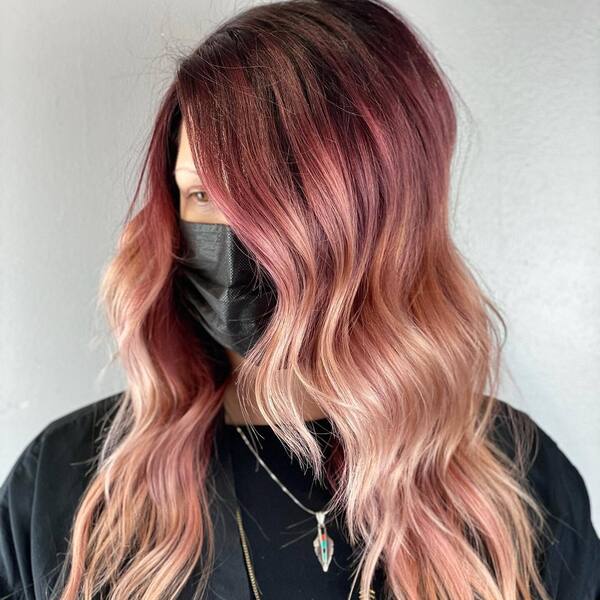 Red to Rose Gold Ombre- a woman wearing a black face mask