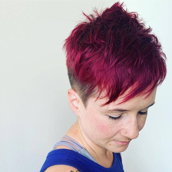 Side Undercut with Colored Messy Pixie Cut- a woman wearing a blue tank top