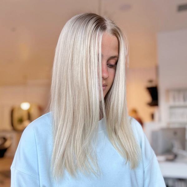 Straight Babylights Blonde- a woman wearing a white over-sized sweater