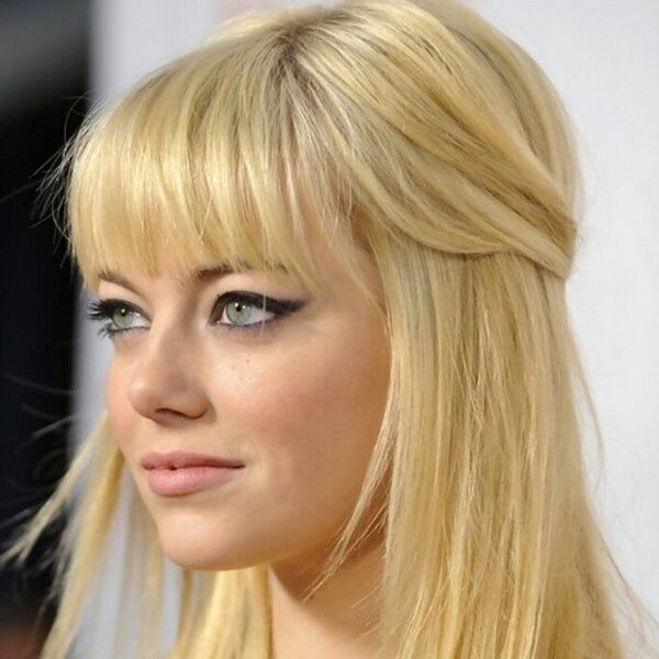 The Half-Up With Full Bangs Hairstyle- Emma Stone wearing a black dress