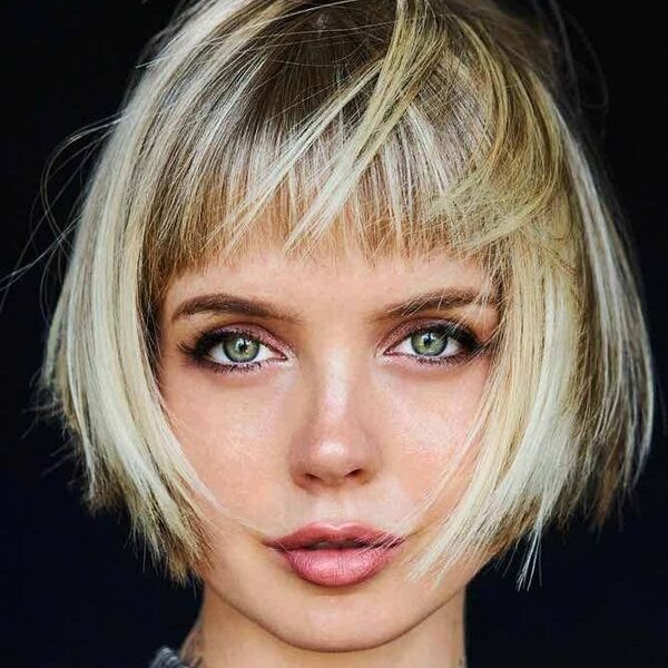 The Short Bob with Straight Bangs- a woman wearing a black turtle neck