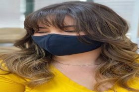 51 Hottest Layered Haircuts for Long Hair to Wear in 2022 - a woman wearing a face mask