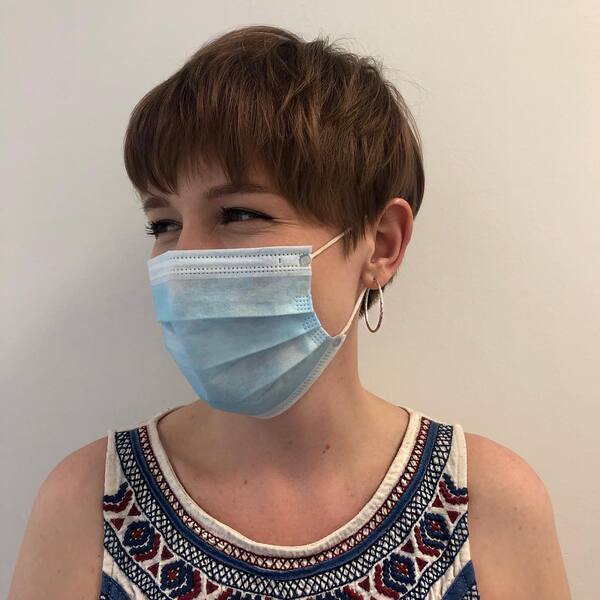 A More Down-to-Earth Pixie Cut- a woman wearing a face mask