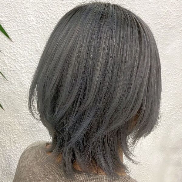 Ashy Grey Asian Hairstyles- a woman wearing a gray sweater