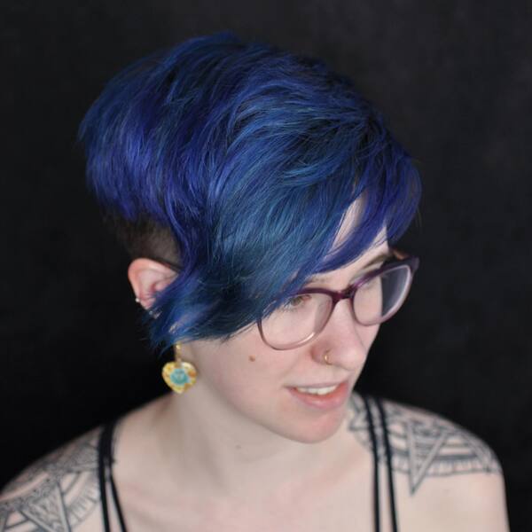 Blue-Violet Highlights Pixie Cut- a woman wearing a black camisole