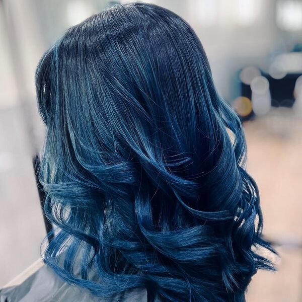 Blue Waves- a woman wearing a barber's cape