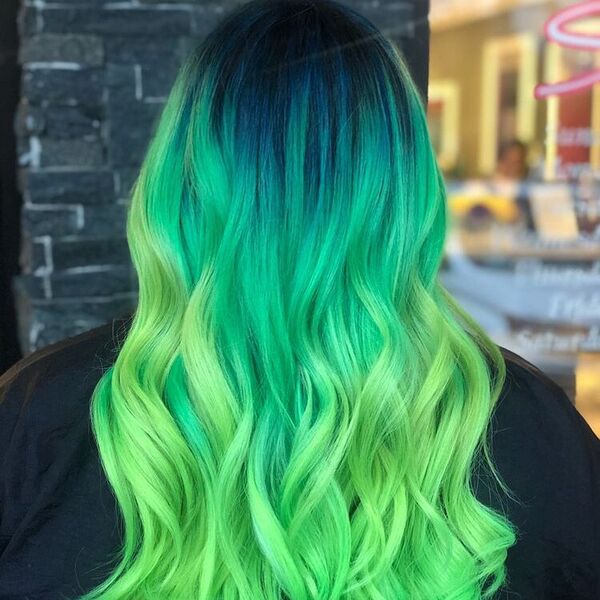 Blue and Green Mermaid Hair- a woman wearing a black barber's cape