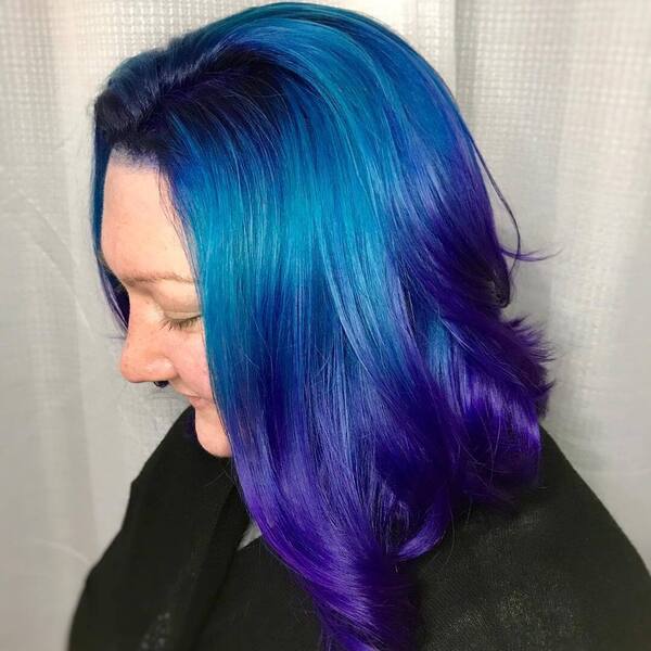 Blue and Purple Ombre Hairstyle- a woman wearing a black dress