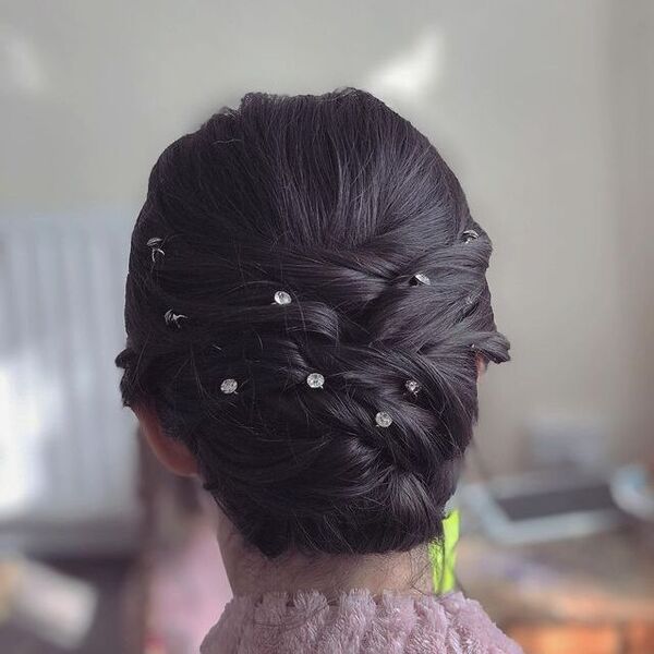 Braided Updo Hairstyle with Rhinestone Pins for Brown Hair- a woman wearing a winter sweater