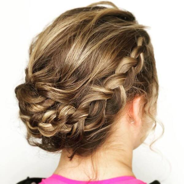 Braided Updos for Medium Hair- a woman wearing a pink t-shirt