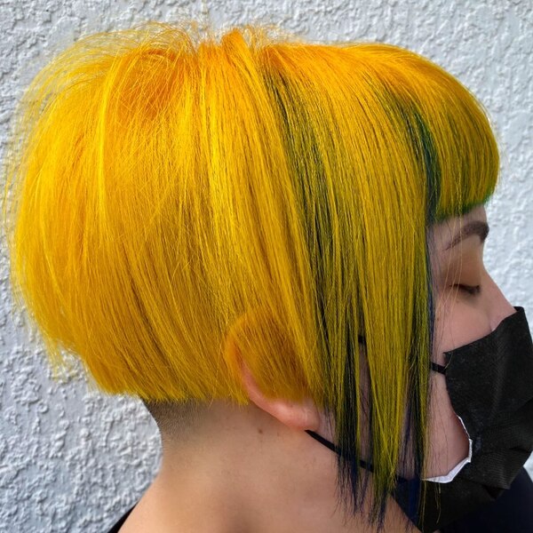 Bright yellow Anime Inspired Hairstyles- a woman wearing a black face mask