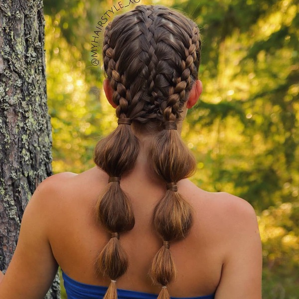 Complex French Braids with Bubble Braid Pigtails- a woman wearing a blue dress