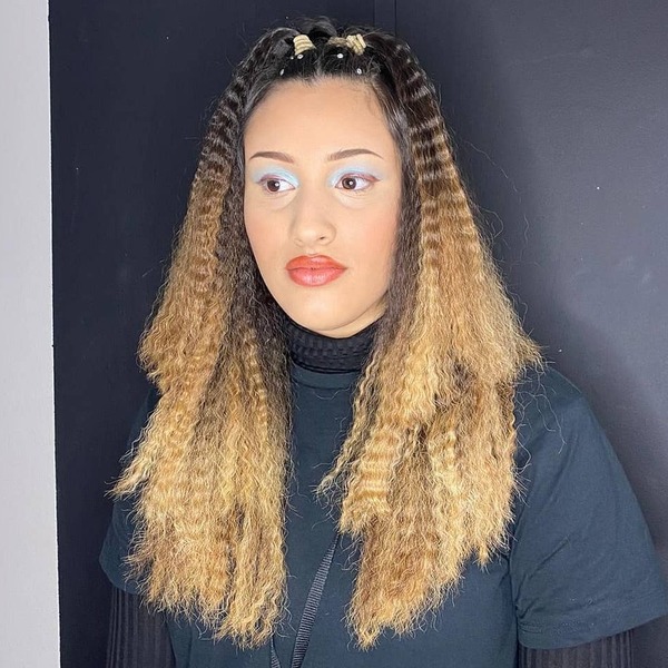 Crimped Hairstyles- a woman wearing a black turtle neck