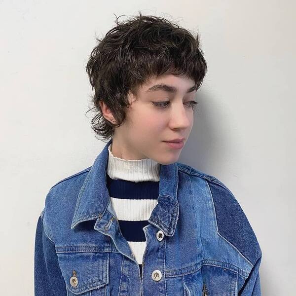 Curly Pixie Cuts- a woman wearing a denim jacket