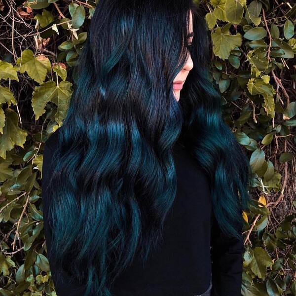 Dark Hair with Deep Turquoise Highlights- a woman wearing a black sweater