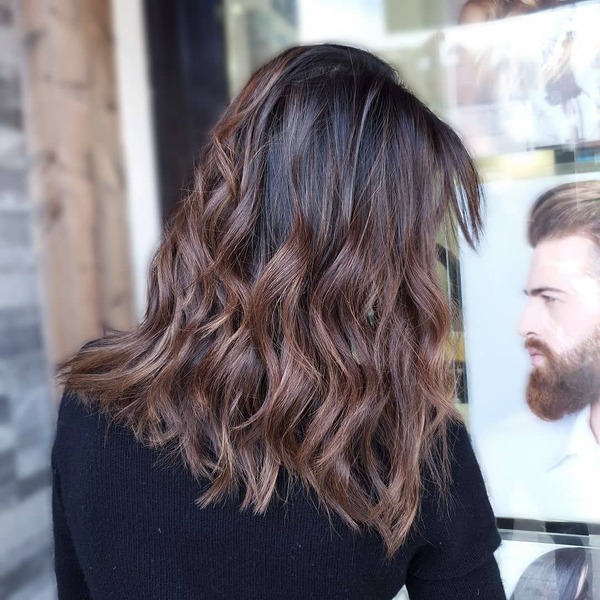 Dark Roots to Medium Brown Body Brunette Balayage-a woman wearing a black blouse