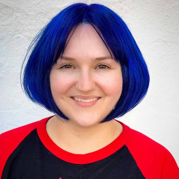 Dark Royal Blue Hair Color- a woman wearing a black-red sweater
