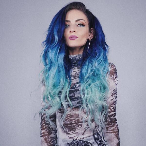 Dark to Light Blue Ombre Balayage Hairstyle- a woman wearing a printed sweater