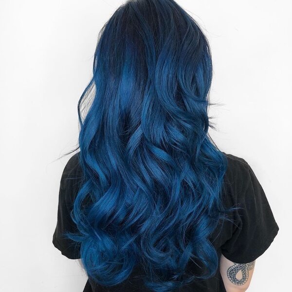 Deep Ocean Blue Hairstyle- a woman wearing a black t-shirt