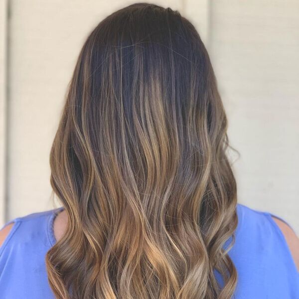 Earthy Fall Ombre Hair Colors- a woman wearing a blue off-shoulder blouse