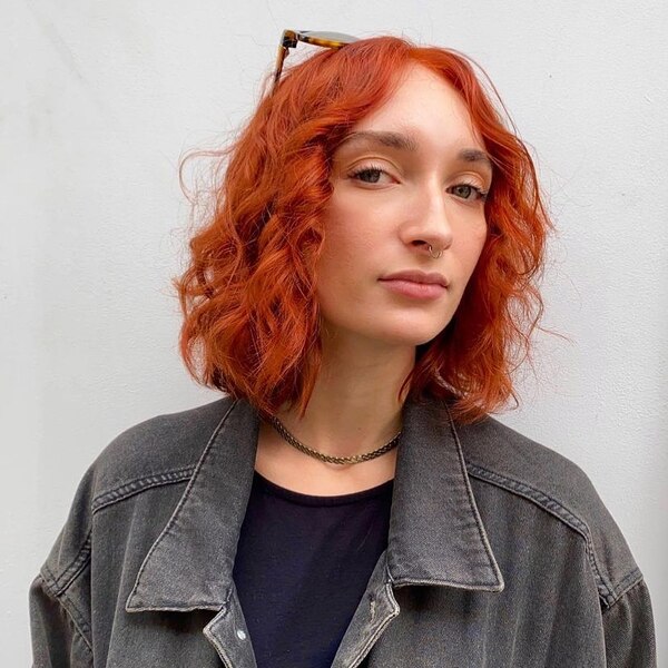 Edgy Ginger Curls- a woman wearing a gray denim jacket