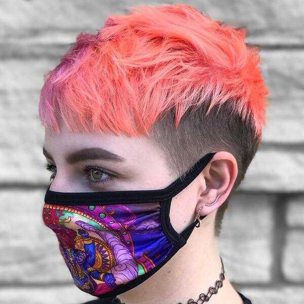 Edgy Pixie Cut- a woman wearing a face mask