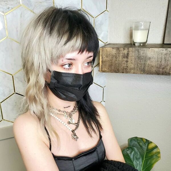 Edgy Shag Mullet Hair- a woman wearing a black face mask
