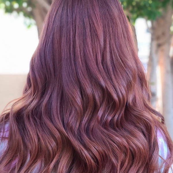 Fall Hair Color with Babylights- a woman wearing a silver blouse