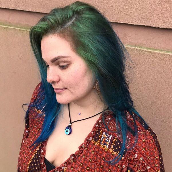 Forest Green Roots with Blue Body Hairstyle- a woman wearing a blouse