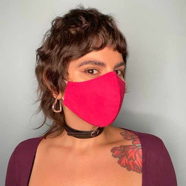 Fun-loving Short Shaggy Hairstyle- a woman wearing a pink face mask