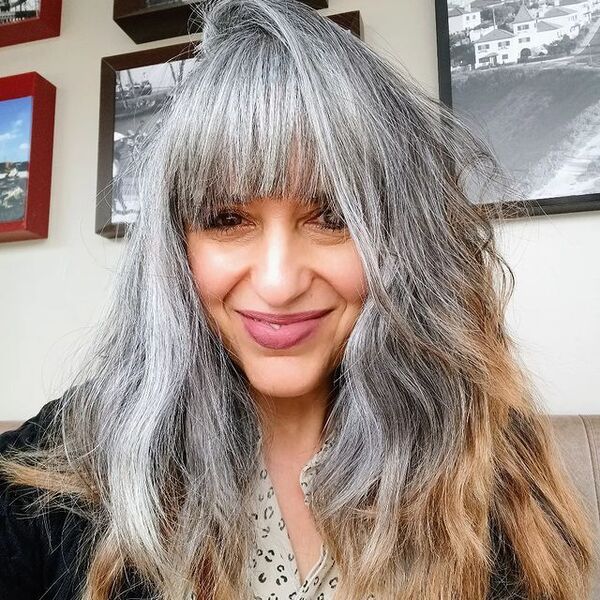 Gray Bangs for Women with Blonde Hair- a woman with gray hair wearing a black jacket