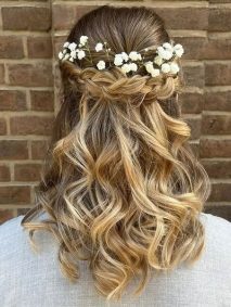 Half Up Half Down Hairstyle for Bride- a woman wearing a gray blouse
