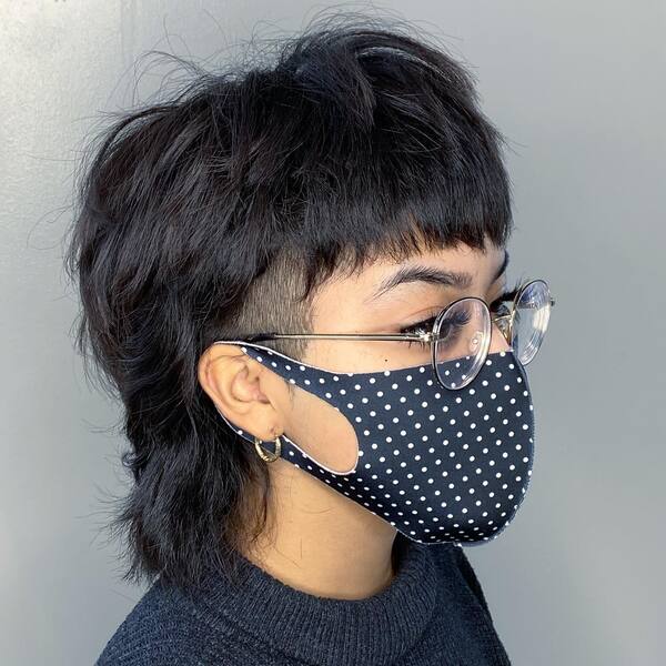 Harry Potter Inspired Edgy Mullet Hairstyles- a woman wearing a black face mask
