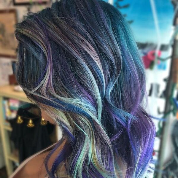 Icy Highlights on Blue, Purple, and Black Mermaid Hair- a woman wearing a white tank top