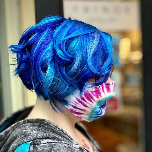 Impossible Waves Anime Inspired Hairstyles- a woman wearing a face mask