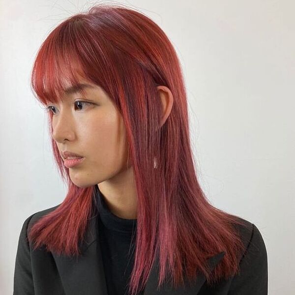 Kurama Inspired Hairstyle- a woman wearing a formal suit