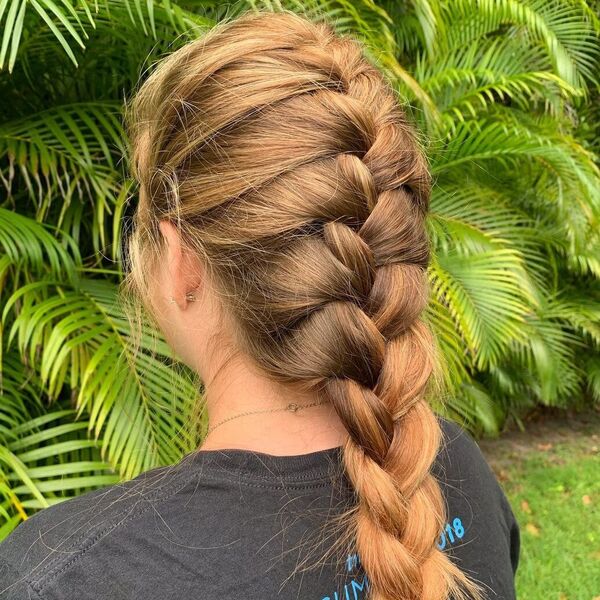 Loose and Relaxed French Braids- a woman wearing a black t-shirt