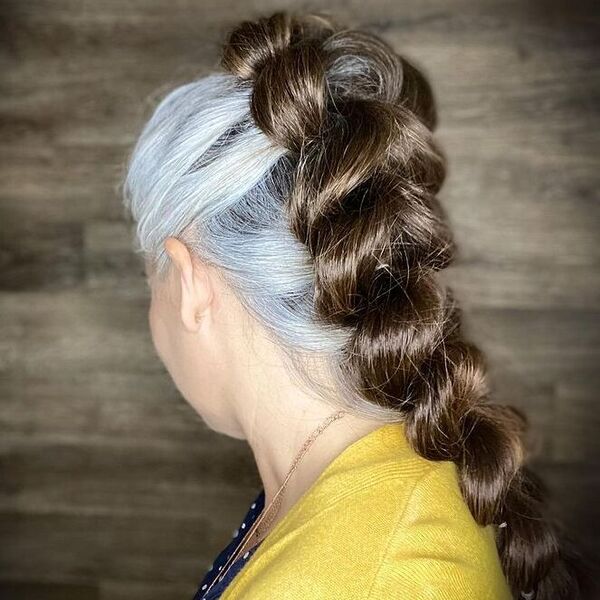 Magic Trick French Braid- a woman with gray hair wearing a yellow blouse