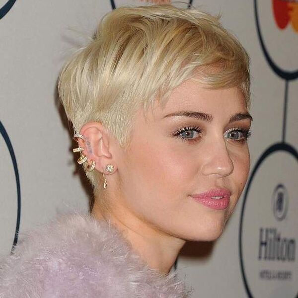 Miley Cyrus's Pixie Cut- Miley Cyrus wearing a white furry dress